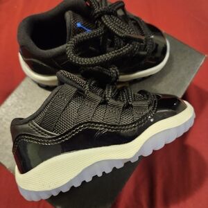 Kids Jordan 11 Black and blue and white. Unisex